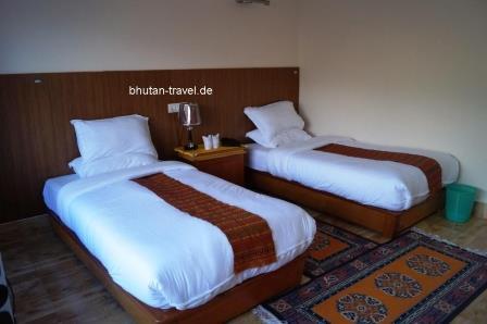 11 Die Betten im Standardzimmer im Hotel Druk Deothjung